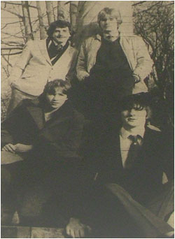 Caption: Sitting Pretty…standing at the back from left to right are Mike Turner, drummer and Greg Stevenson, keyboard player. Front left is Julian Amos, lead guitarist next to him Pete Long, bassist.