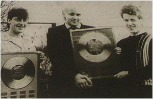 Caption: DIDN’T THEY DO WELL…Lloyd Barnett (left) and Mark Mortimer receive their Musicbox poll trophies from the column’s editor Sam Holliday (centre).