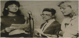 Caption: Three of the Tam Aid singers join in the chorus of the song ‘Anger Can Be Power’ from left; Dave Ingham (lead singer One On One), Debbie Whitty (lead singer Femme Fatale) and Star Trek (lead singer Sacred Oath).