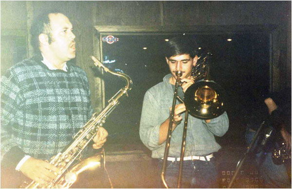 This is the recording session for "Love 15" and "Mousetrap!" at UB40's Abbatoir Studios in Birmingham in October 1985. It shows Harry Facer (tenor sax) and Paul Stansfield (trombone) along with (right) Andy Codling (alto sax).