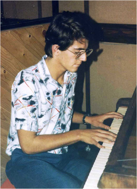 In October 1985 Chris Taylor was a young teenage keyboard prodigy and he is photographed here playing piano on the song "Love 15" at UB40's Abbatoir Studios. He later went on to become a celebrated international jazz musician of some repute.