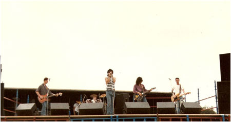 “The Pyschedelicatessen"  at Tamworth Rock Festival 1989. The close up pic is Andy Lane, Paul Aspel  and at the back Geoff Hales The long shot is left to right, Ian Gould on bass, Mark Hayes, Andy Lane, Paul Aspel and Geoff Hales. 